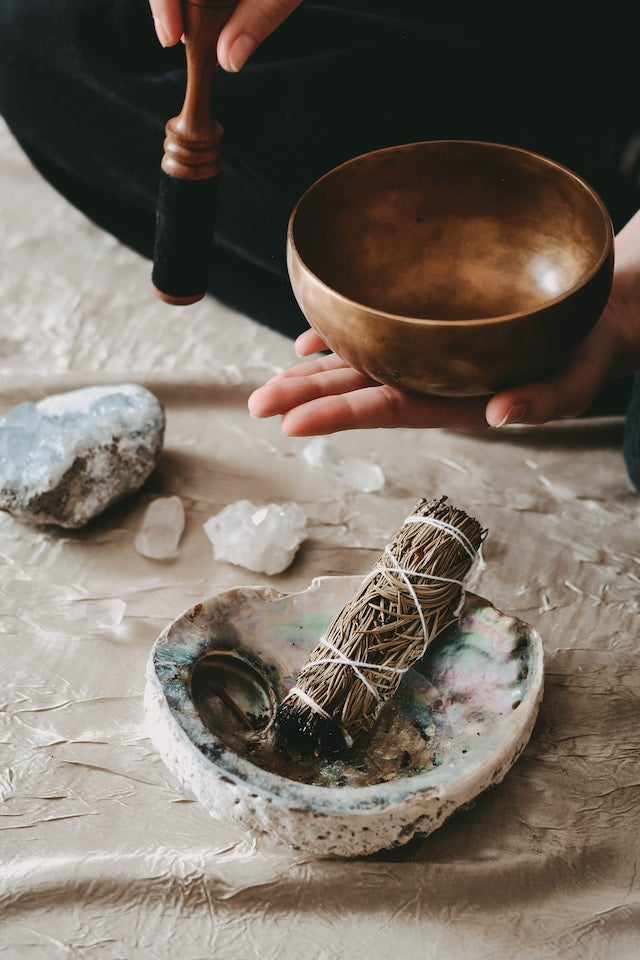 Bowl, crystals, and burning sage