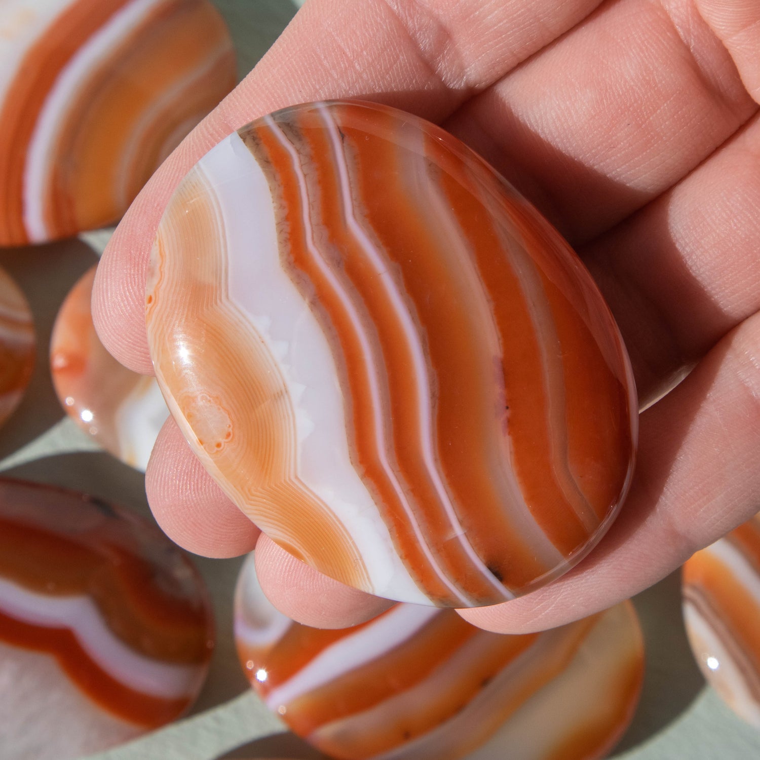 red agate, red agate palm stone, crystal palm stone, gemstone palm stone, red agate crystal, red agate stone, red agate properties, red agate healing properties, red agate metaphysical properties, red agate meaning